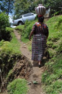 Carrying water back home in a clay pot on my head