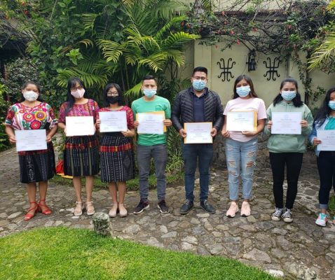 The graduates of our English class proudly showing their certificates