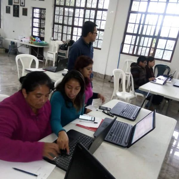 Laptop donations at Backyard School